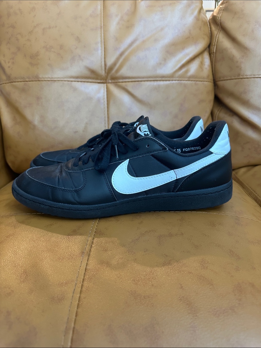 Nike Black Low-Top Sneakers with White Swoosh and Heel